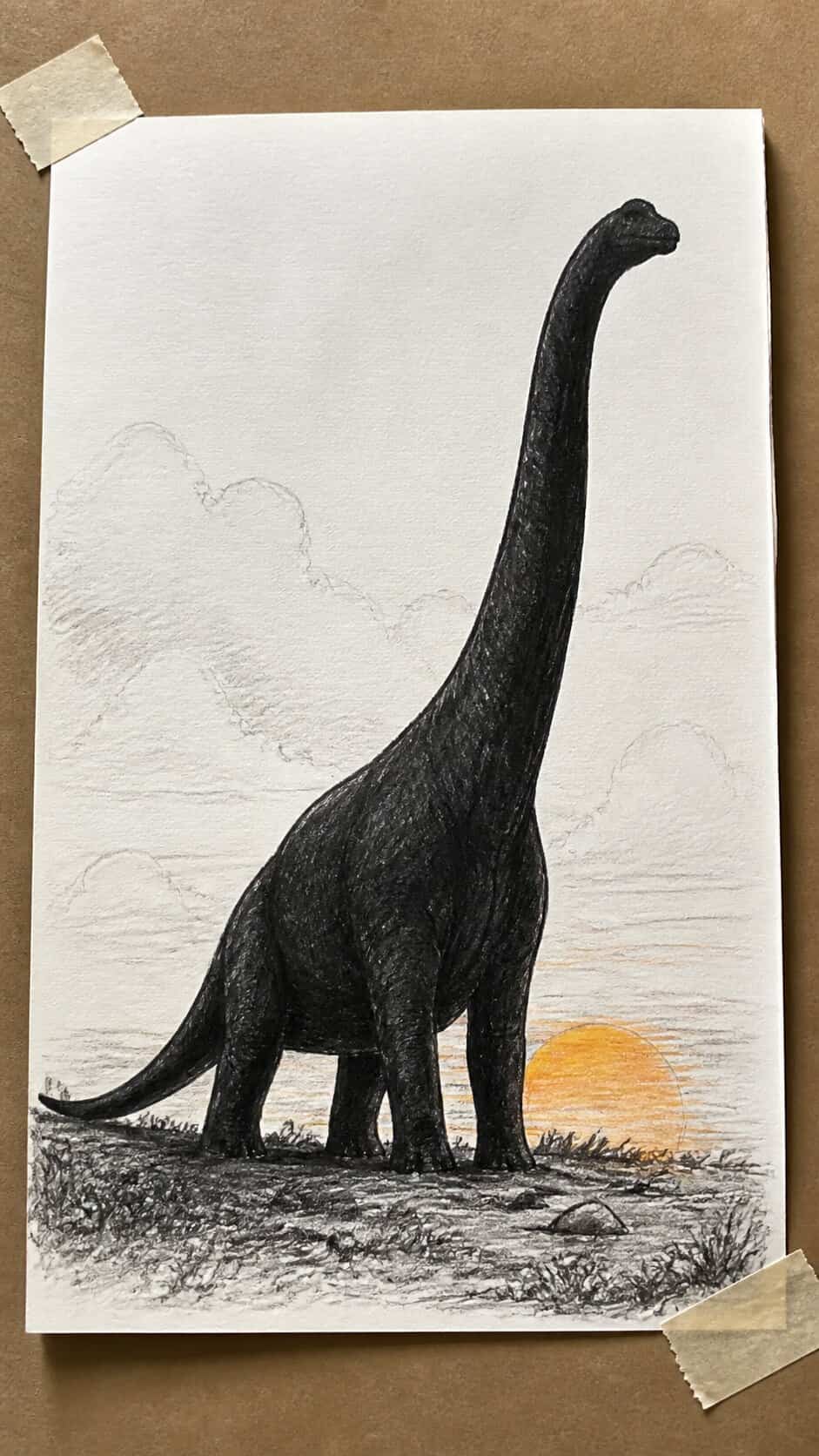 Hand-drawn brachiosaurus silhouette in mixed-media hand drawing on textured paper, shown in a gentle oblique desk view that shows — study 1
