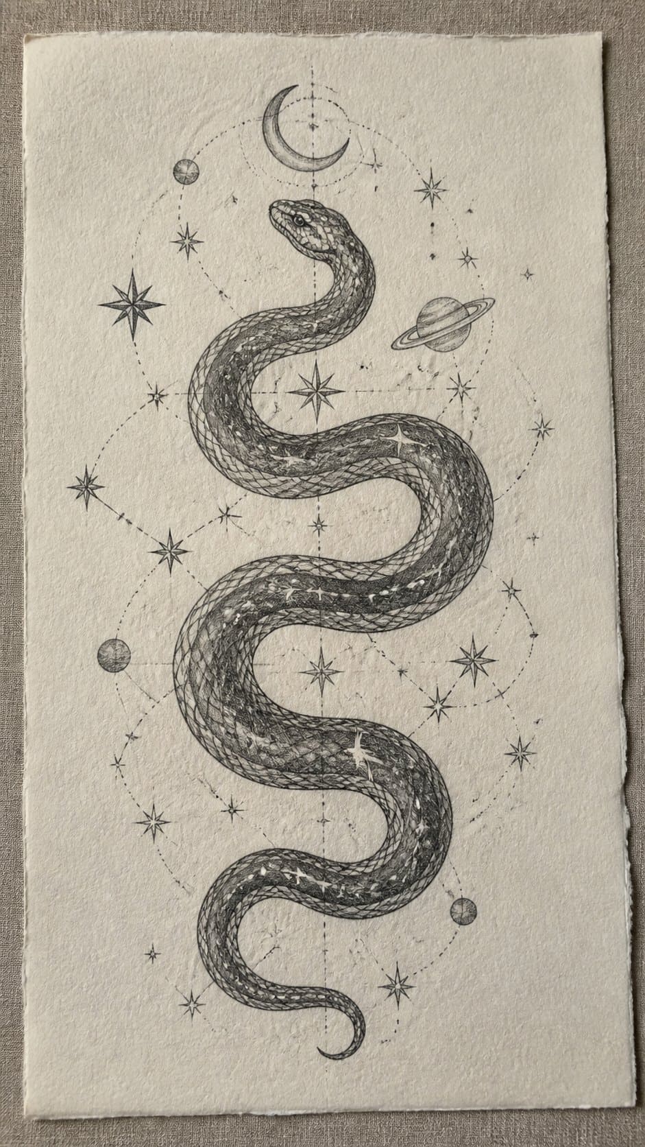 18 Snake Drawing Ideas to Slither Into Your Sketchbook 7 Hand-drawn celestial snake with stars in graphite drawing on textured paper, shown in a slightly off-center overhead composition, like — study 1