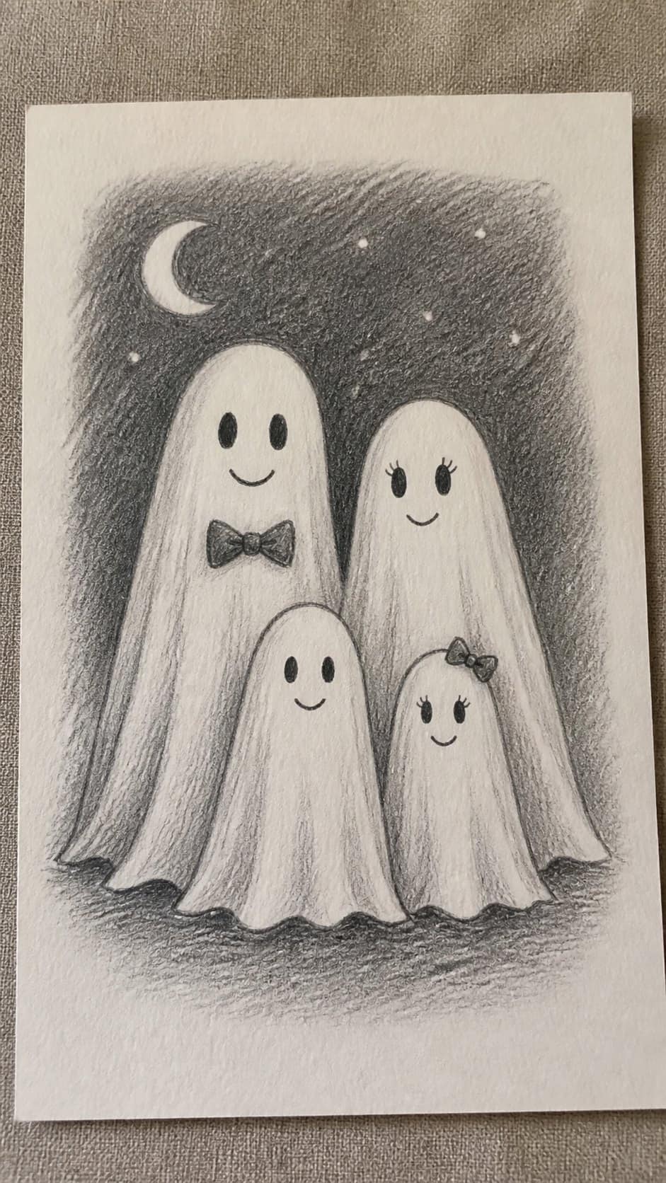 18 Ghost Drawing Ideas for Spooky and Expressive Sketches 14 Hand-drawn ghost family portrait in graphite drawing on textured paper, shown in a slightly off-center overhead composition, like an — study 1