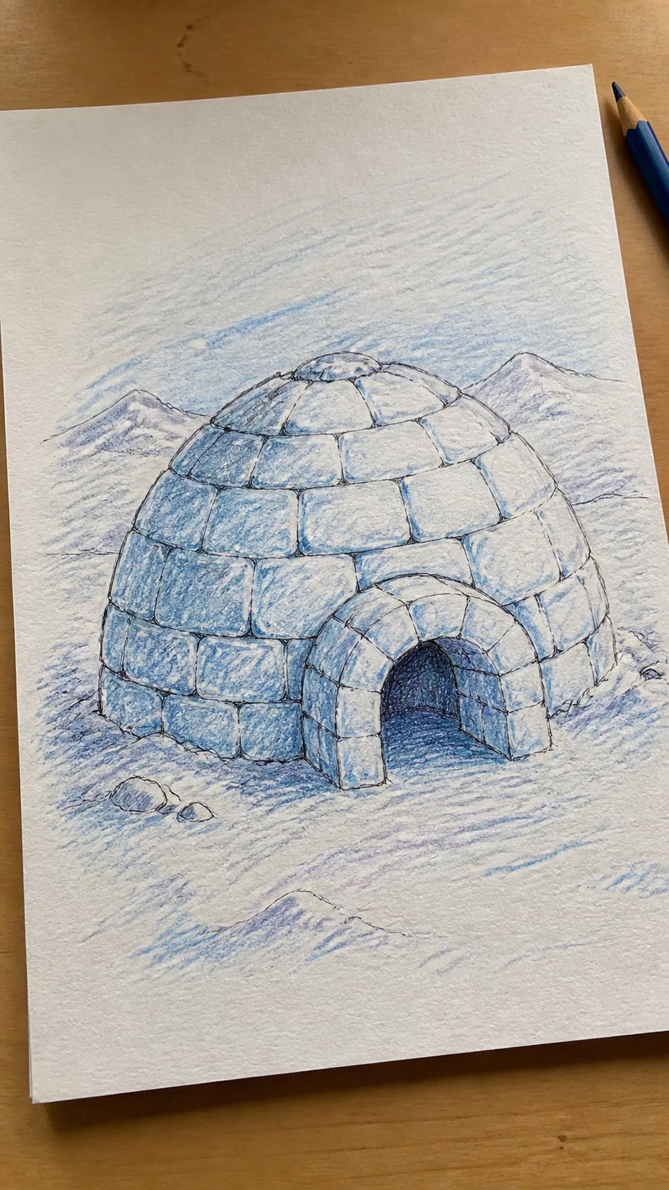 Hand-drawn igloo in colored-pencil drawing on textured paper, shown in a slightly off-center overhead composition, like an artist — study 1