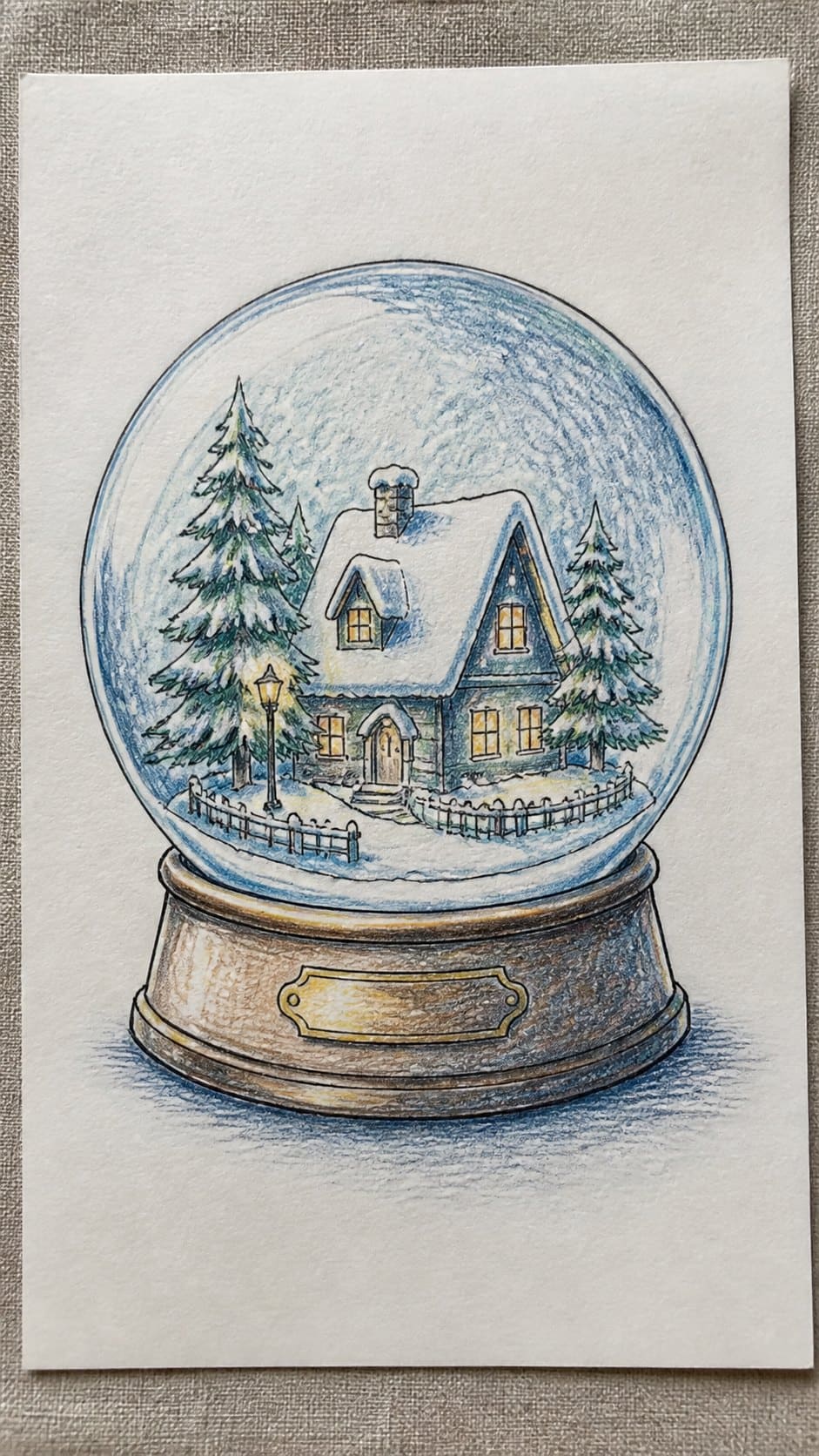 Hand-drawn snow globe in colored-pencil drawing on textured paper, shown in a close overhead crop — study 1