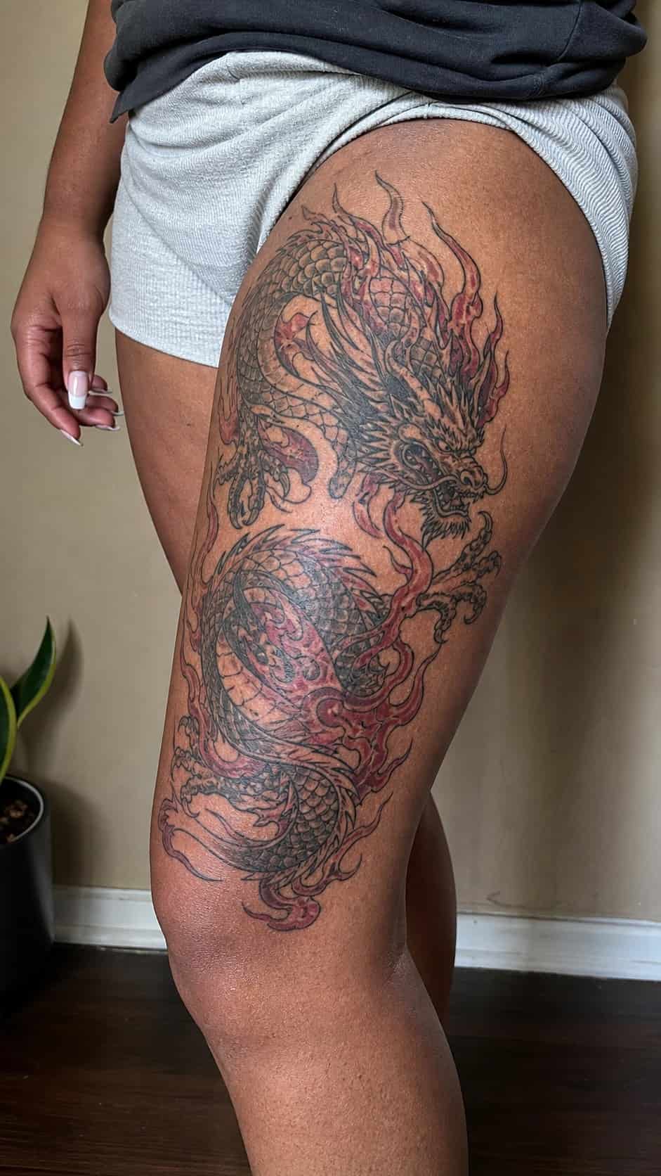 Empowering and Beautiful: 23 Japanese Tattoos for the Modern Woman 6 Healed fiery dragon majesty tattoo on a adult woman's outer thigh, photographed in a natural gentle side angle that clearly shows how — study 1