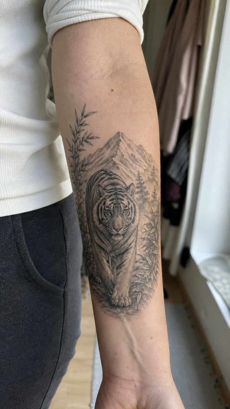 Empowering and Beautiful: 23 Japanese Tattoos for the Modern Woman 11 Healed majestic tiger strength tattoo on a adult woman's inner forearm, photographed in a natural straight-on close view, a touch — study 2