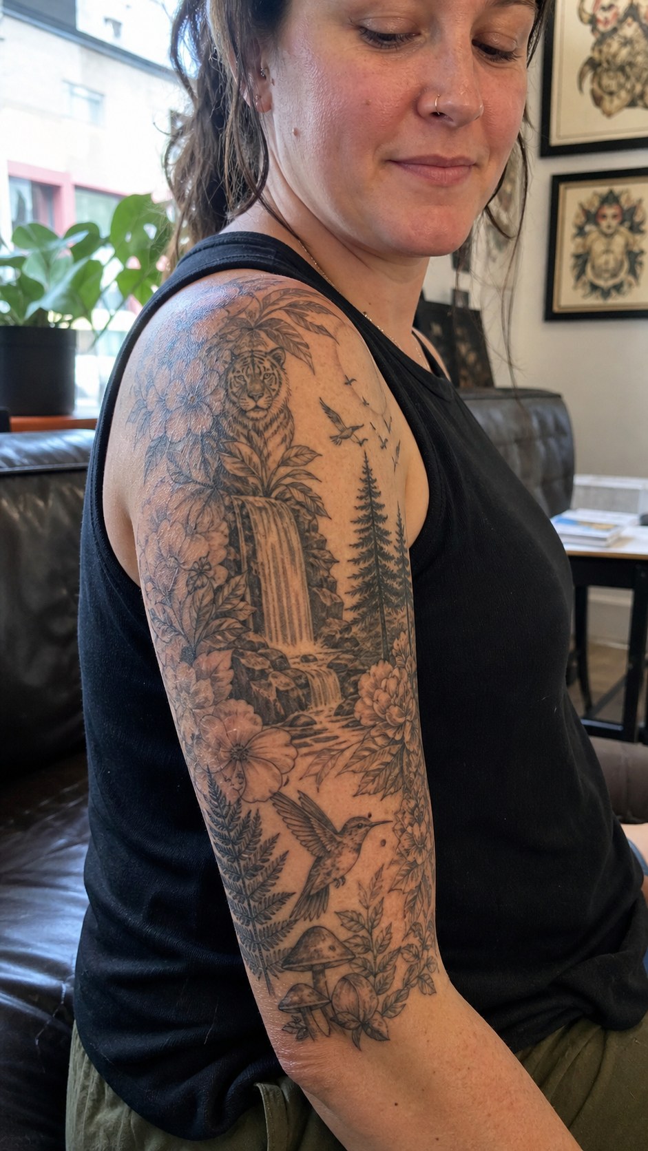 Empowering and Beautiful: 23 Japanese Tattoos for the Modern Woman 17 Healed sleeve of nature tattoo on a adult woman's upper-arm sleeve, photographed in a natural casual close three-quarter view — study 2
