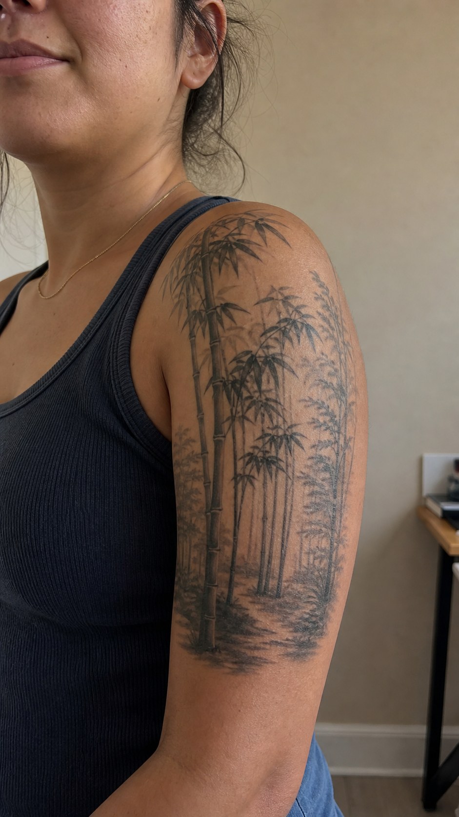 Empowering and Beautiful: 23 Japanese Tattoos for the Modern Woman 27 Healed the tranquil bamboo forest tattoo on a adult woman's shoulder, photographed in a natural straight-on close view, a touch — study 1