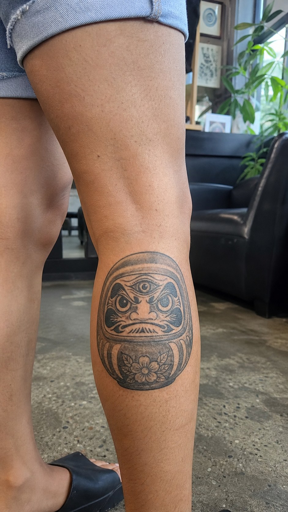 Empowering and Beautiful: 23 Japanese Tattoos for the Modern Woman 32 Healed the all-seeing daruma tattoo on a adult woman's outer calf, photographed in a natural casual close three-quarter view — study 1