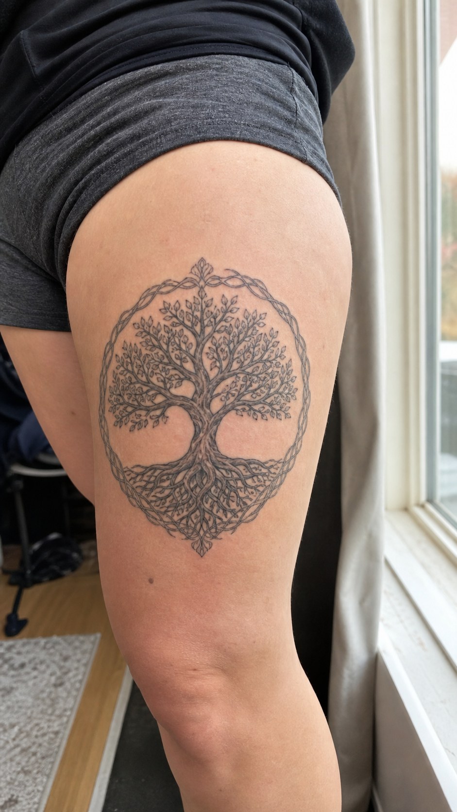 38 Creative Tattoo Ideas for Women 25 Healed tree of life tattoo on a adult woman's outer thigh, photographed in a natural relaxed documentary crop — study 1
