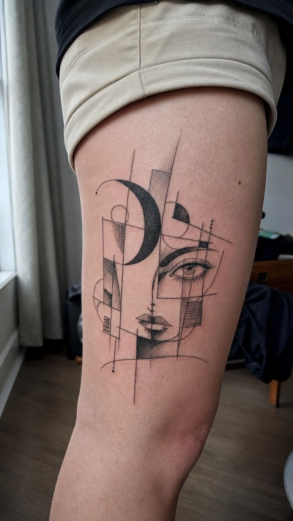 38 Creative Tattoo Ideas for Women 31 Healed abstract art tattoo on a adult woman's outer thigh, photographed in a natural slightly elevated close view — study 2
