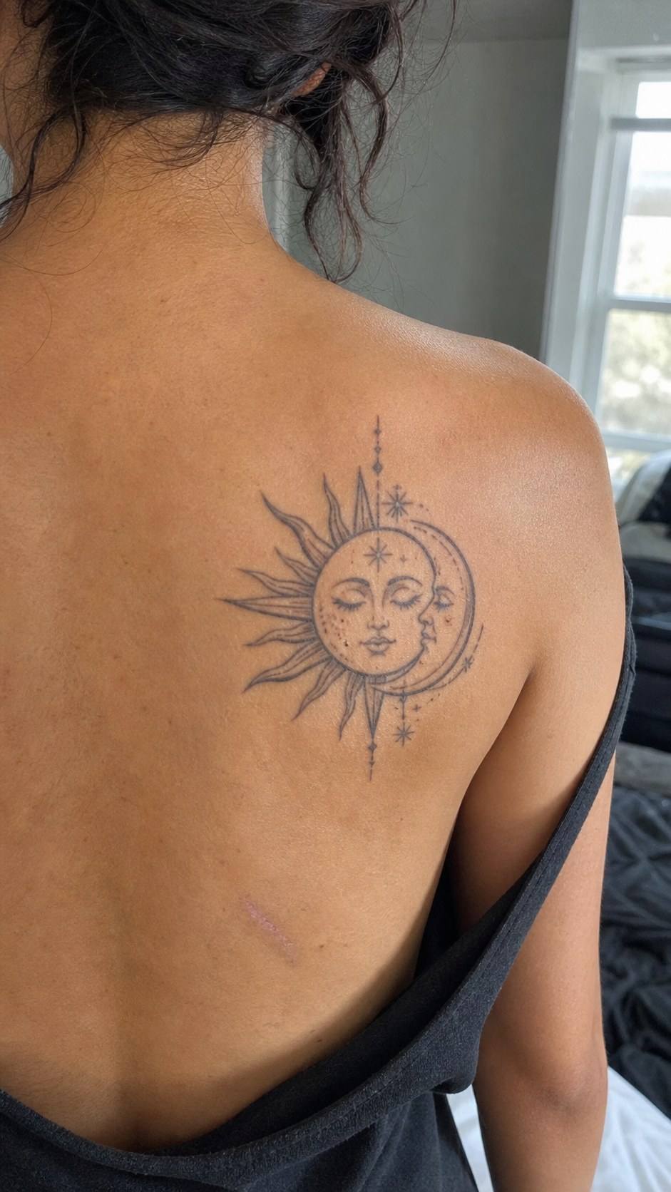 38 Creative Tattoo Ideas for Women 37 Healed sun and moon tattoo on a adult woman's upper back, photographed in a natural straight-on close view, a touch off-center like a — study 1