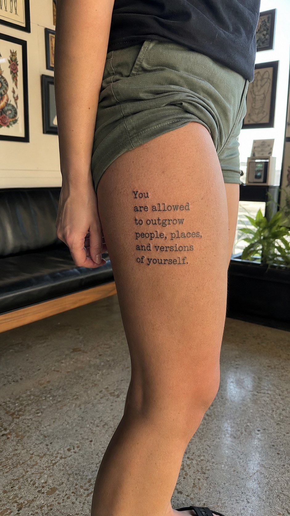 Healed motivational quote tattoo on a adult woman's outer thigh, photographed in a natural gentle side angle that clearly shows how — study 1