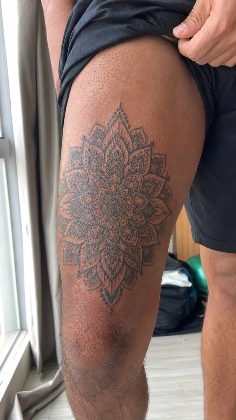 Feeling Bold? Try These 25 Killer Thigh Tattoo Ideas for Men 10 Healed intricate mandala pattern tattoo on a adult man's outer thigh, photographed in a natural gentle side angle that clearly shows — study 2