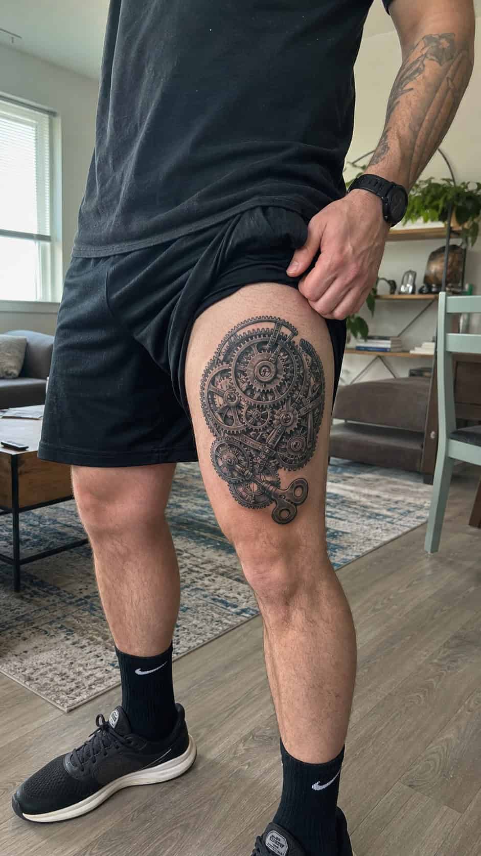 Feeling Bold? Try These 25 Killer Thigh Tattoo Ideas for Men 24 Healed mechanical gears and clockwork tattoo on a adult man's behind the ear, photographed in a natural waist-height candid close-up — study 1