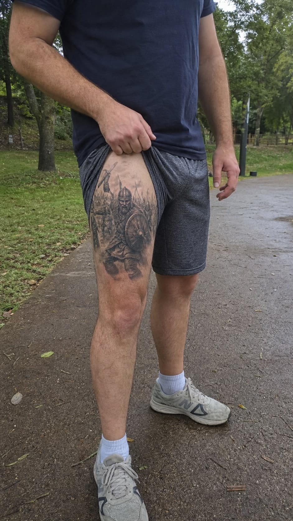 Feeling Bold? Try These 25 Killer Thigh Tattoo Ideas for Men 46 Healed viking warrior in battle tattoo on a adult man's outer thigh, photographed in a natural slightly elevated close view — study 1