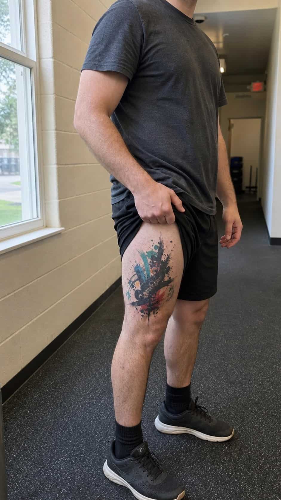 Feeling Bold? Try These 25 Killer Thigh Tattoo Ideas for Men 52 Healed artistic graffiti tattoo on a adult man's outer thigh, photographed in a natural gentle side angle that clearly shows how the — study 2