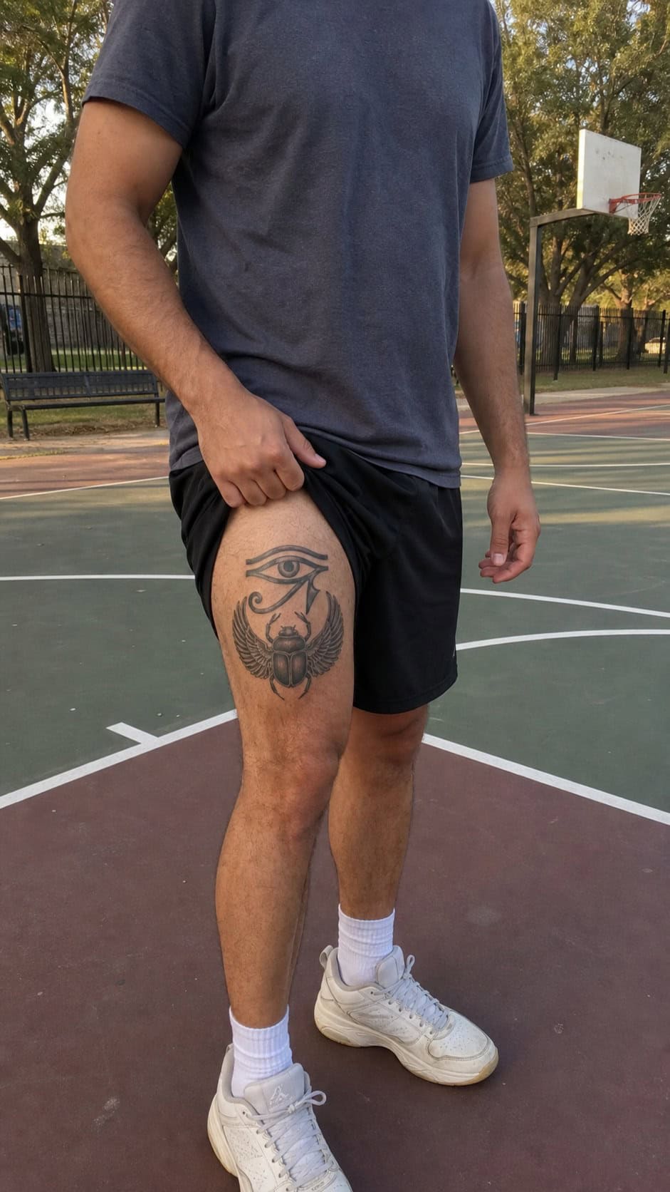 Feeling Bold? Try These 25 Killer Thigh Tattoo Ideas for Men 57 Healed ancient egyptian symbol tattoo on a adult man's outer thigh, photographed in a natural straight-on close view, a touch — study 3