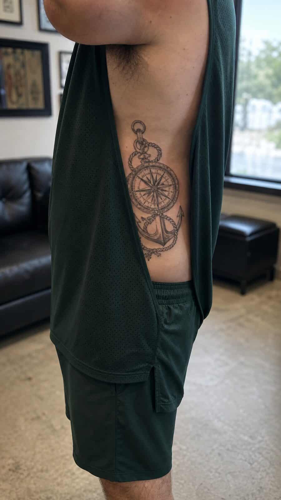 25 Rib Tattoos for Men Worth Considering 19 Healed nautical compass tattoo on a adult man's side ribs, photographed in a natural slightly elevated close view — study 1