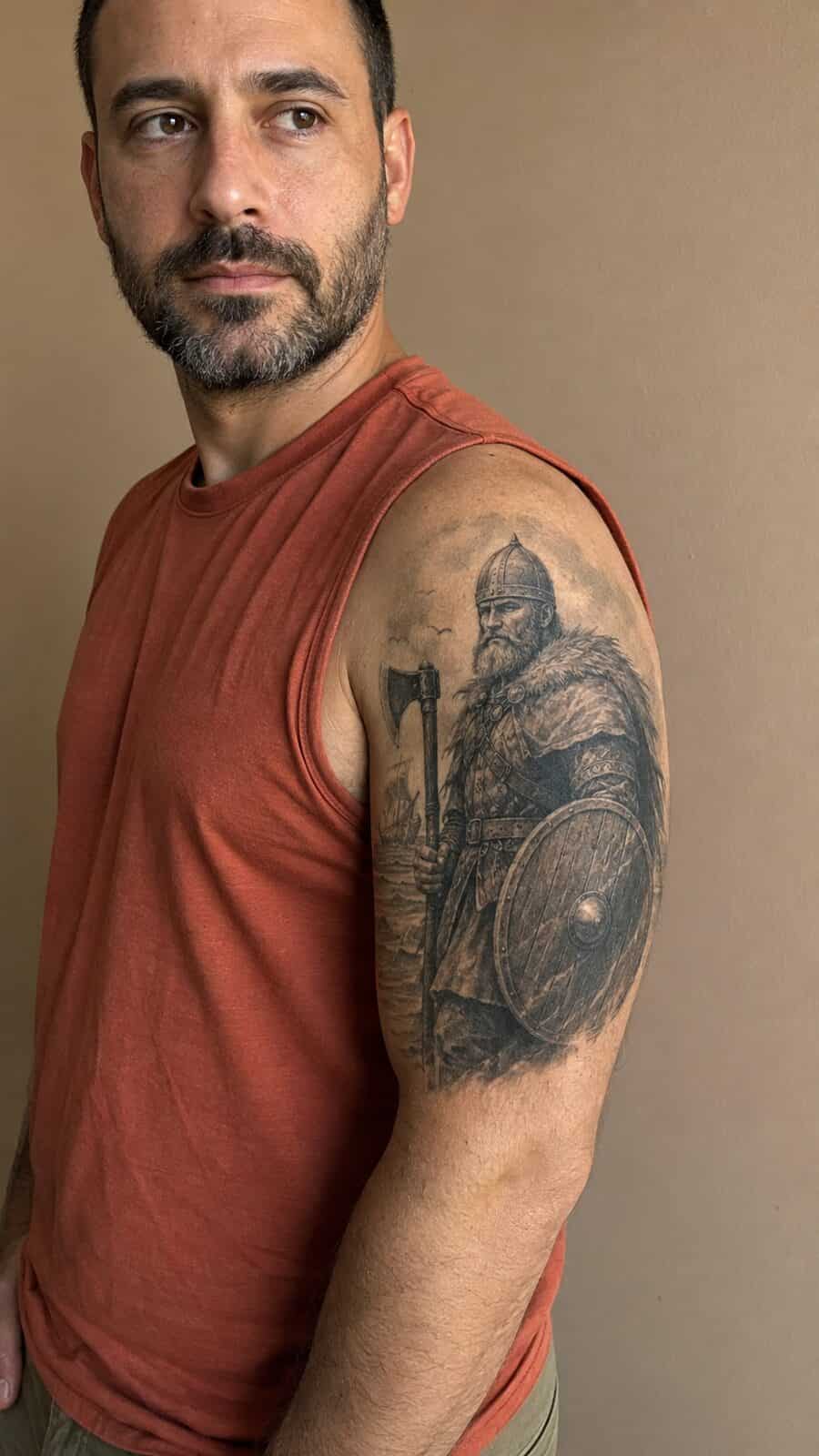 Unlock Your Next Ink: 25 Epic Upper Arm Tattoo Ideas for Men 47 Healed viking warrior tattoo on a adult man's outer upper arm, photographed in a natural straight-on close view, a touch off-center — study 2