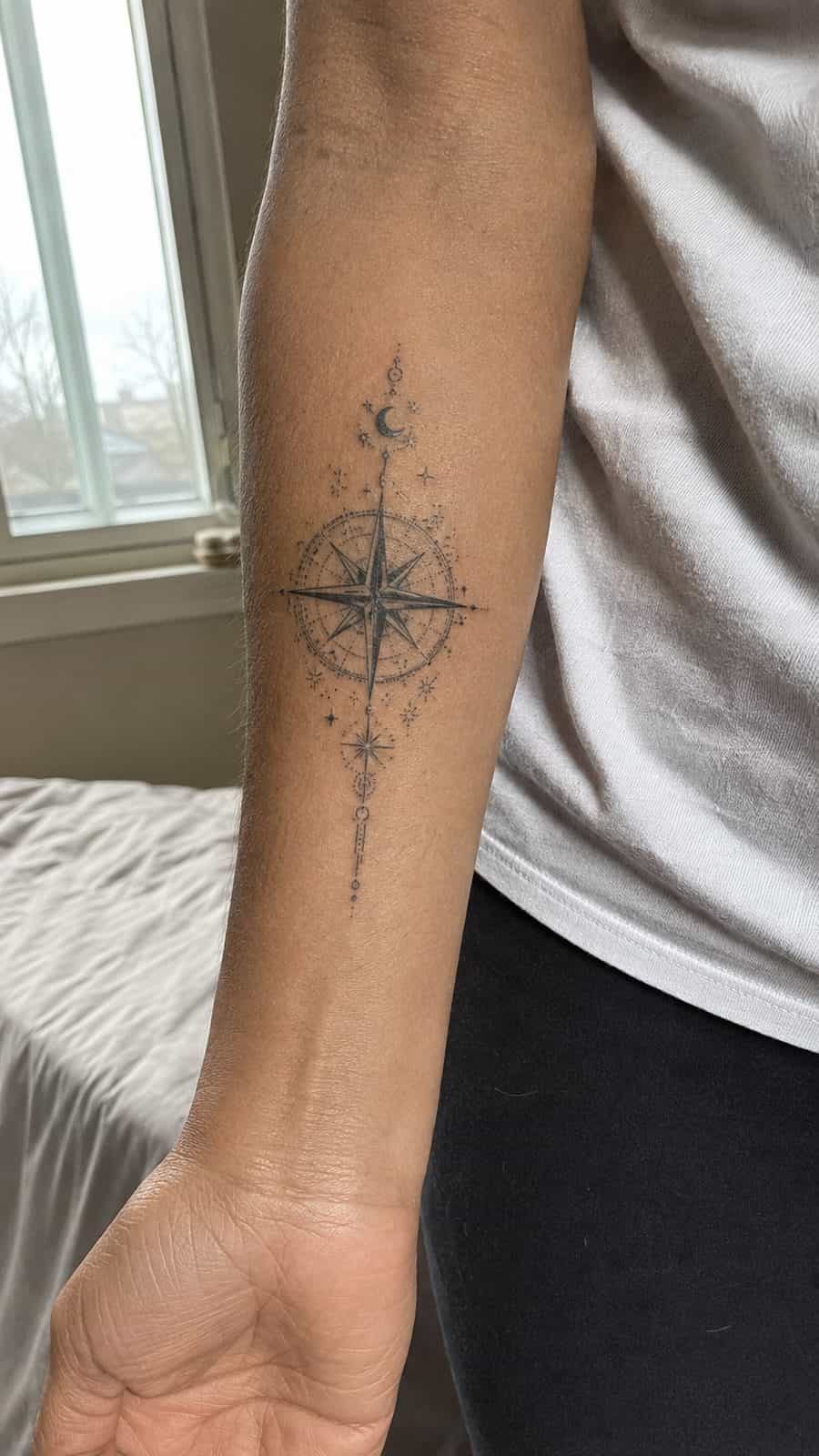35 Forearm Tattoos for Women Worth Considering 9 Healed celestial compass tattoo on a adult woman's inner forearm, photographed in a natural waist-height candid close-up — study 2