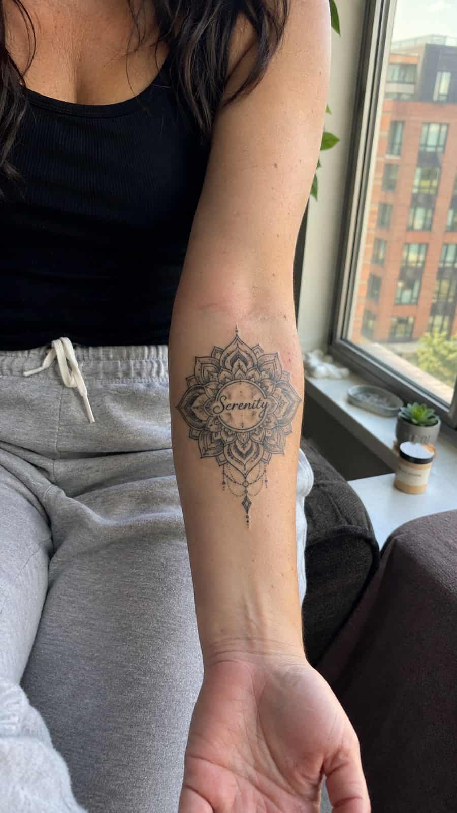 35 Forearm Tattoos for Women Worth Considering 14 Healed serenity mandala tattoo on a adult woman's inner forearm, photographed in a natural slightly elevated close view — study 2