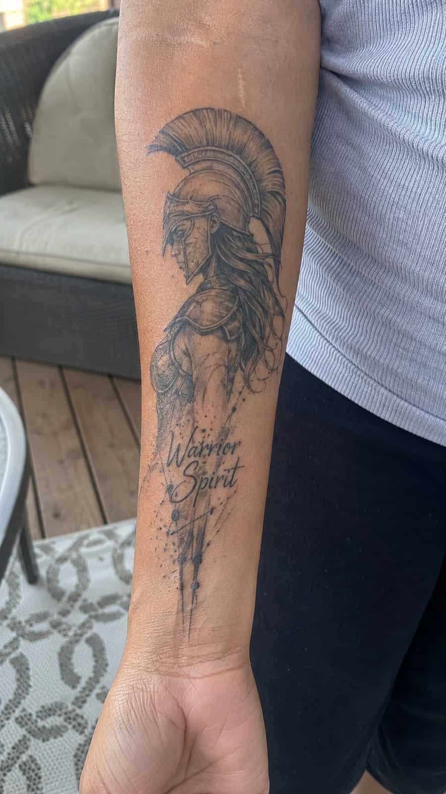 35 Forearm Tattoos for Women Worth Considering 21 Healed warrior spirit tattoo on a adult woman's inner forearm, photographed in a natural slightly elevated close view — study 2