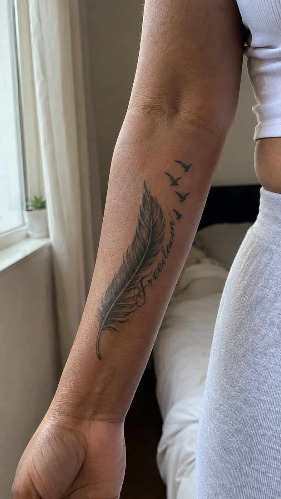 35 Forearm Tattoos for Women Worth Considering 27 Healed feathered freedom tattoo on a adult woman's inner forearm, photographed in a natural gentle side angle that clearly shows how — study 1