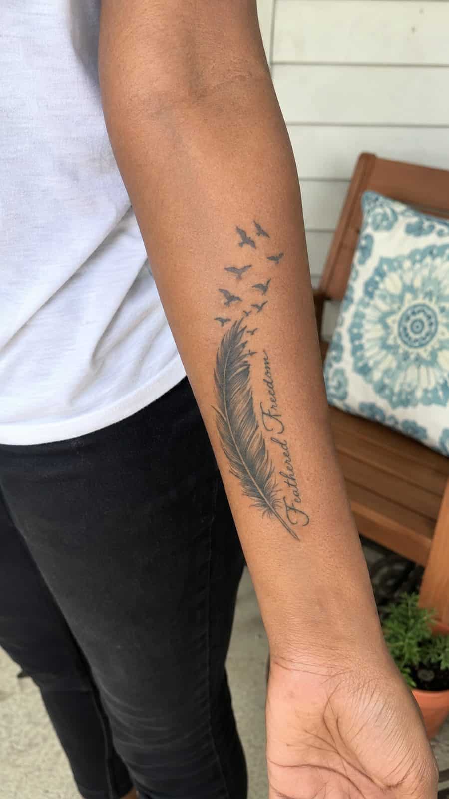35 Forearm Tattoos for Women Worth Considering 28 Healed feathered freedom tattoo on a adult woman's inner forearm, photographed in a natural slightly elevated close view — study 2