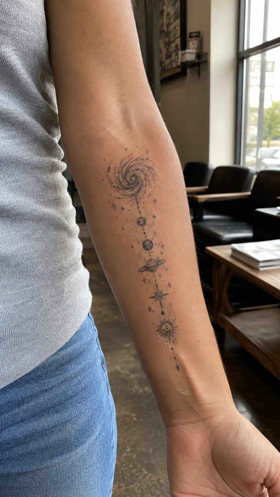 35 Forearm Tattoos for Women Worth Considering 30 Healed cosmic connection tattoo on a adult woman's inner forearm, photographed in a natural casual close three-quarter view — study 2