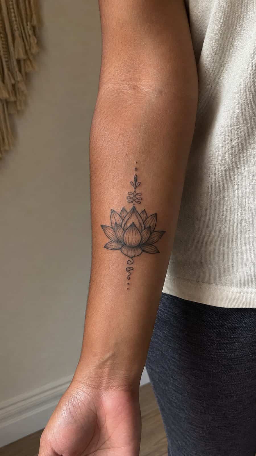 35 Forearm Tattoos for Women Worth Considering 31 Healed lotus blossom tattoo on a adult woman's inner forearm, photographed in a natural gentle side angle that clearly shows how the — study 1