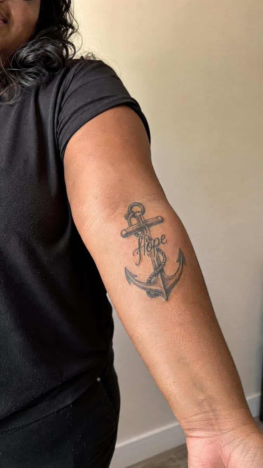 35 Forearm Tattoos for Women Worth Considering 36 Healed anchor of hope tattoo on a adult woman's inner forearm, photographed in a natural casual close three-quarter view — study 1