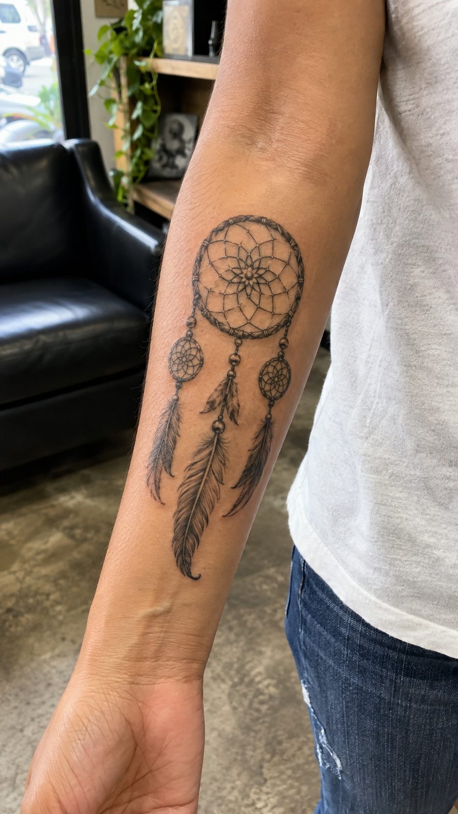 35 Forearm Tattoos for Women Worth Considering 38 Healed dreamcatcher tattoo on a adult woman's inner forearm, photographed in a natural casual close three-quarter view — study 1