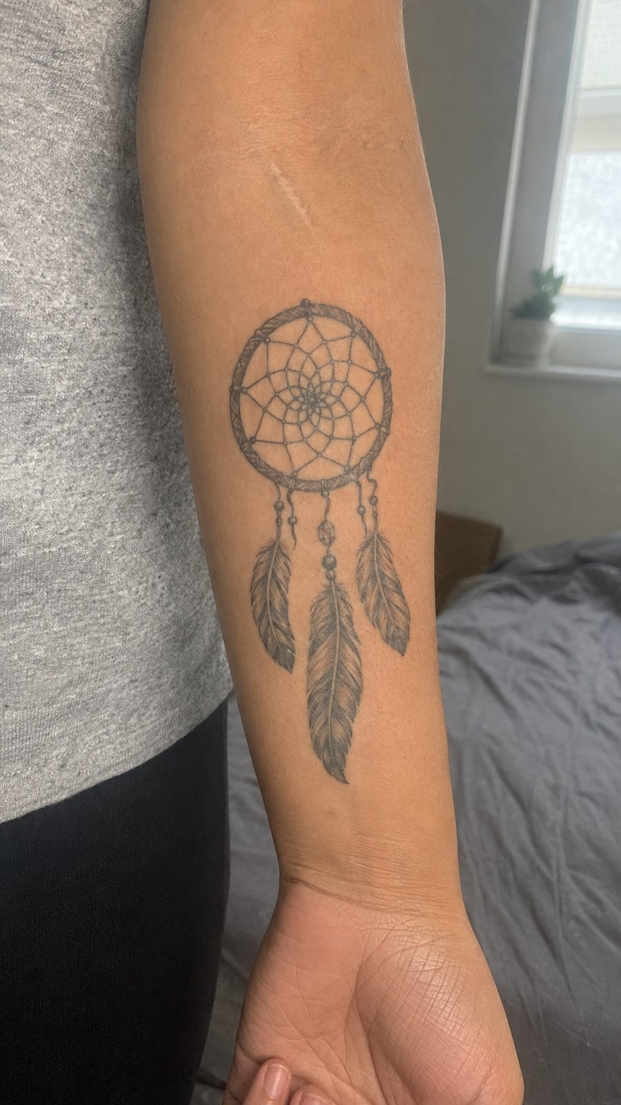 35 Forearm Tattoos for Women Worth Considering 39 Healed dreamcatcher tattoo on a adult woman's inner forearm, photographed in a natural straight-on close view, a touch off-center like — study 2