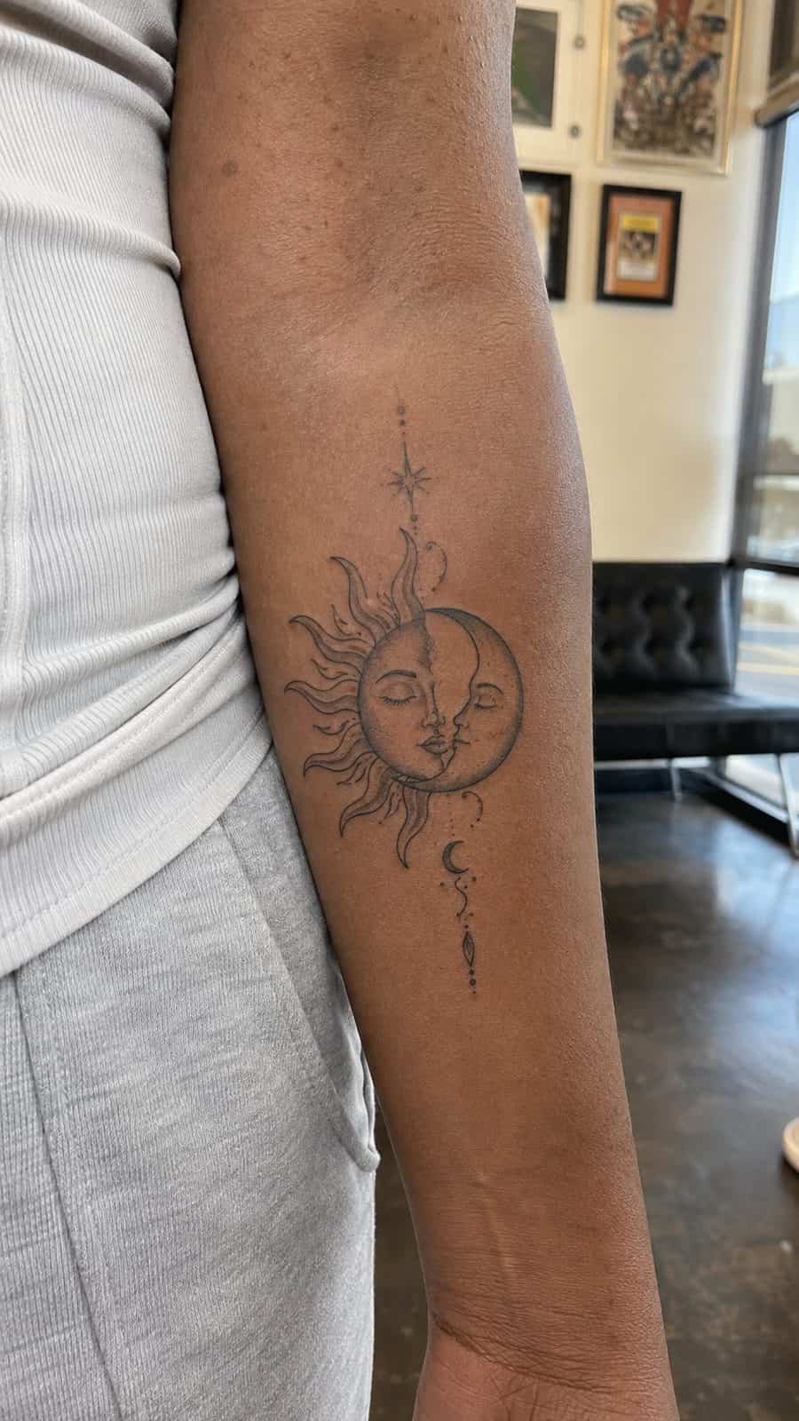 35 Forearm Tattoos for Women Worth Considering 41 Healed sun and moon balance tattoo on a adult woman's inner forearm, photographed in a natural straight-on close view, a touch — study 1
