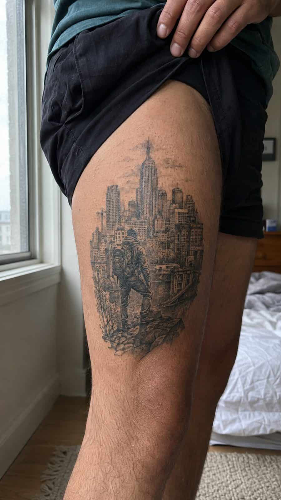 48 Tattoo Ideas for Men Worth Considering for Your Next Ink 10 Healed urban expedition tattoo on a adult man's outer thigh, photographed in a natural waist-height candid close-up — study 2