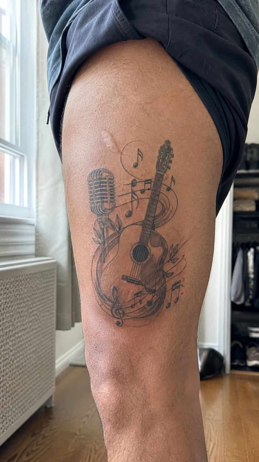 48 Tattoo Ideas for Men Worth Considering for Your Next Ink 14 Healed harmonious tunes tattoo on a adult man's outer thigh, photographed in a natural relaxed documentary crop — study 2