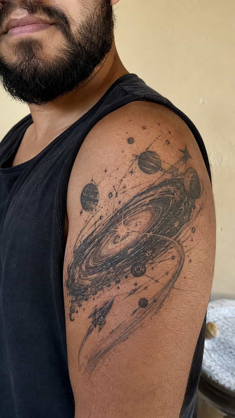 48 Tattoo Ideas for Men Worth Considering for Your Next Ink 23 Healed stellar odyssey tattoo on a adult man's shoulder, photographed in a natural straight-on close view, a touch off-center like a — study 2