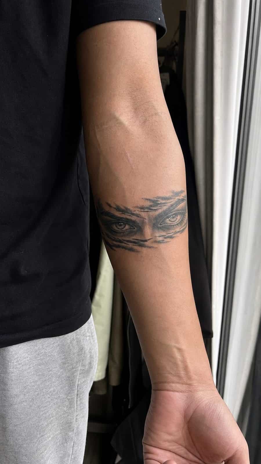 Unleash Your Dark Side: 23 Devilishly Unique Tattoo Ideas for Men 24 Healed devilish eyes tattoo on a adult man's inner forearm, photographed in a natural gentle side angle that clearly shows how the ink — study 1