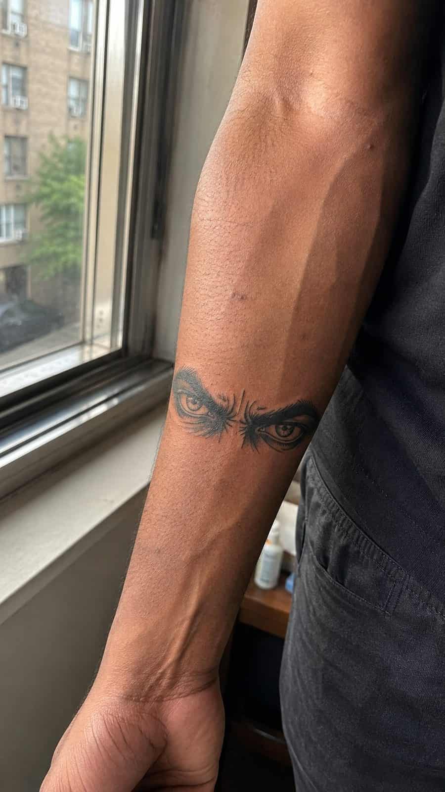 Unleash Your Dark Side: 23 Devilishly Unique Tattoo Ideas for Men 25 Healed devilish eyes tattoo on a adult man's inner forearm, photographed in a natural slightly elevated close view — study 2