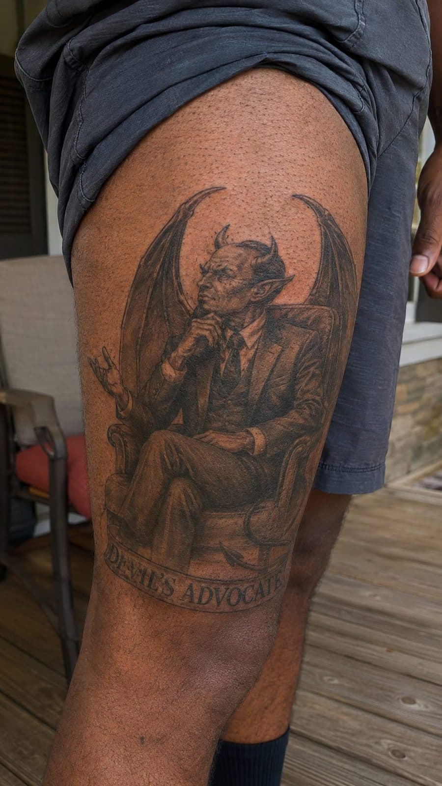 Unleash Your Dark Side: 23 Devilishly Unique Tattoo Ideas for Men 31 Healed devil’s advocate tattoo on a adult man's outer thigh, photographed in a natural slightly elevated close view — study 2