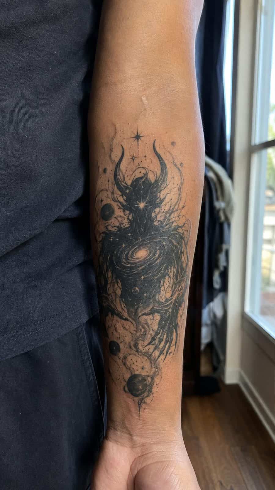 Unleash Your Dark Side: 23 Devilishly Unique Tattoo Ideas for Men 34 Healed cosmic demonic entity tattoo on a adult man's inner forearm, photographed in a natural straight-on close view, a touch — study 1
