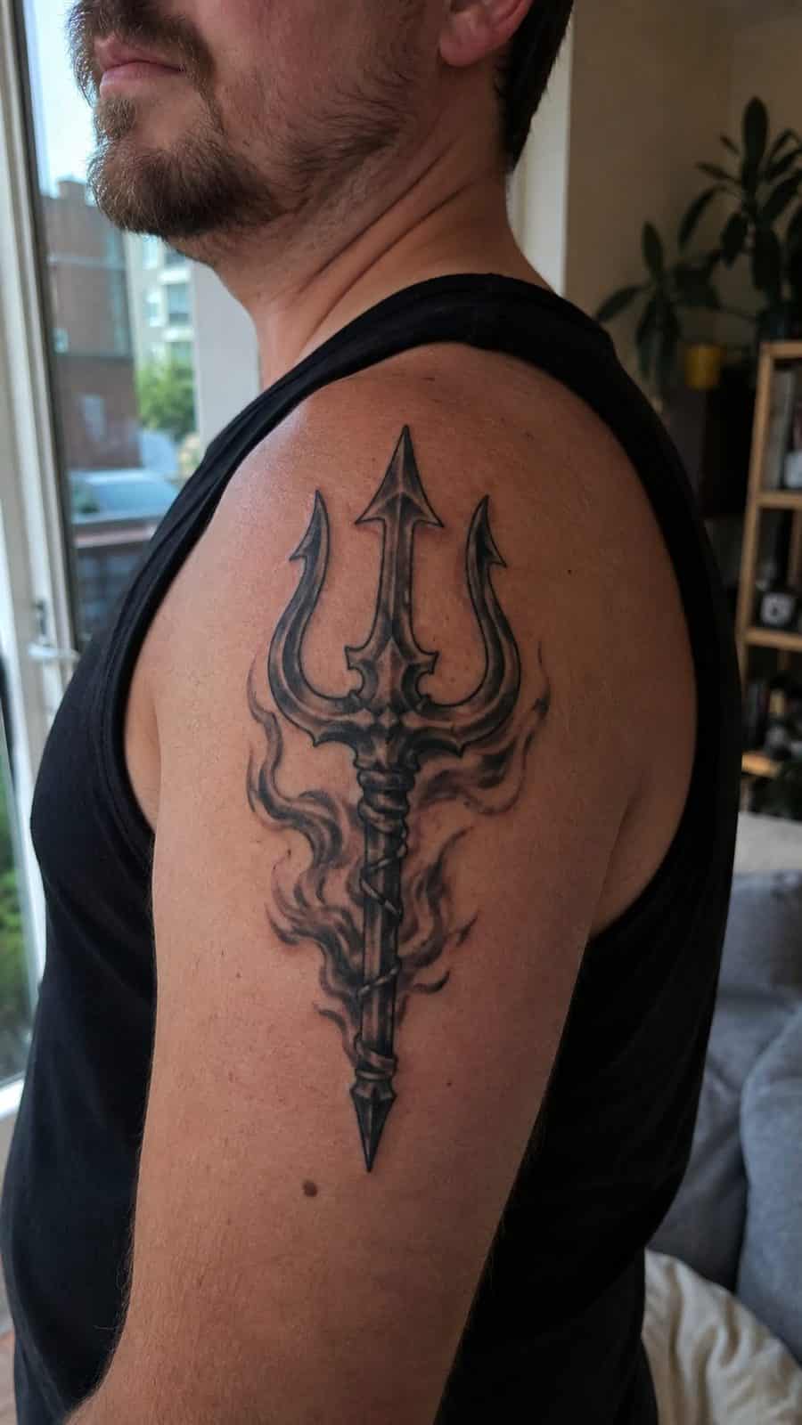 Unleash Your Dark Side: 23 Devilishly Unique Tattoo Ideas for Men 47 Healed devil’s trident tattoo on a adult man's shoulder, photographed in a natural slightly elevated close view — study 2