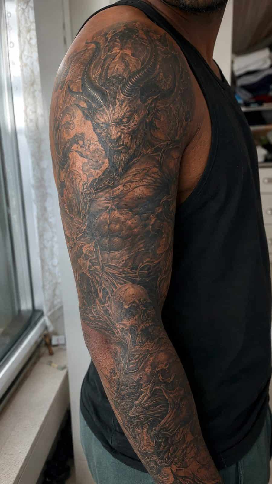Unleash Your Dark Side: 23 Devilishly Unique Tattoo Ideas for Men 51 Healed fiendish full sleeve tattoo on a adult man's upper-arm sleeve, photographed in a natural slightly elevated close view — study 2