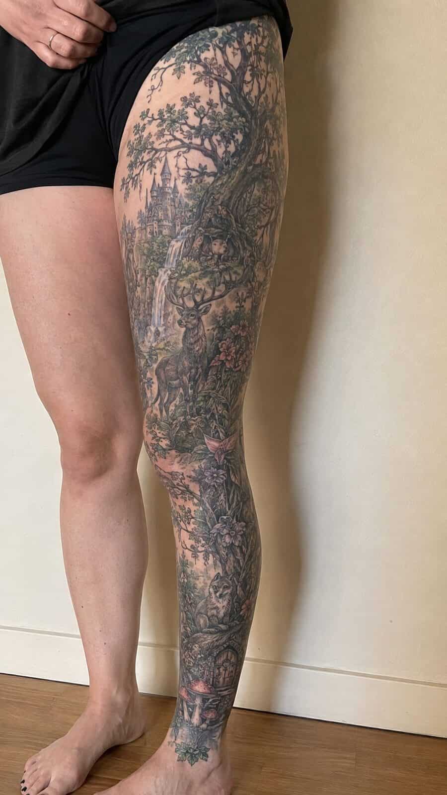 32 Gorgeous Female Leg Sleeve Tattoos 4 Healed enchanted forest fantasy tattoo on a adult woman's full outer leg sleeve, photographed in a natural straight-on close view, a — study 3