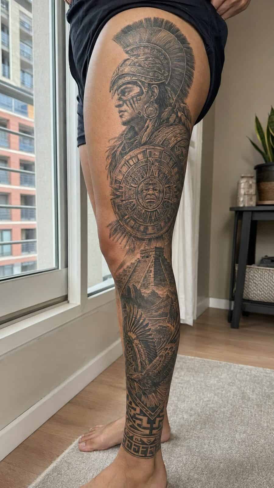 32 Gorgeous Female Leg Sleeve Tattoos 11 Healed ancient warrior spirit tattoo on a adult woman's full outer leg sleeve, photographed in a natural straight-on close view, a — study 1
