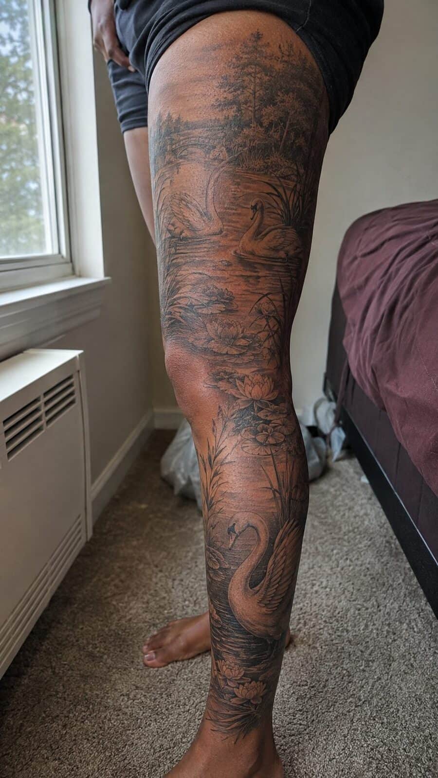 32 Gorgeous Female Leg Sleeve Tattoos 31 Healed graceful swan lake tattoo on a adult woman's full outer leg sleeve, photographed in a natural slightly elevated close view — study 1