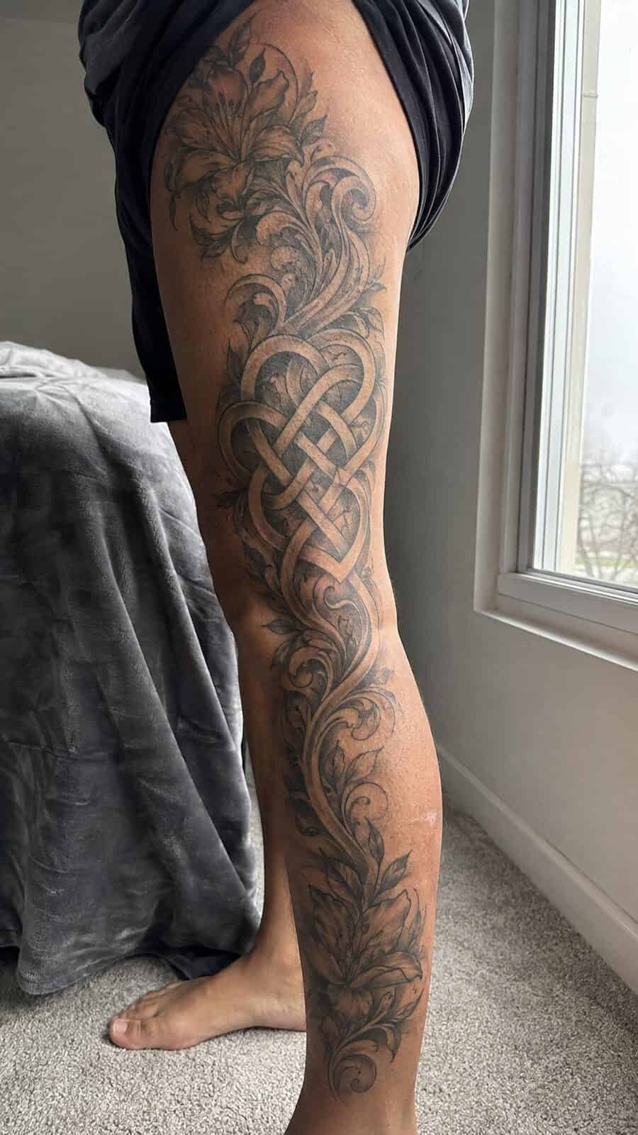 32 Gorgeous Female Leg Sleeve Tattoos 42 Healed eternal love knot tattoo on a adult woman's full outer leg sleeve, photographed in a natural straight-on close view, a touch — study 1