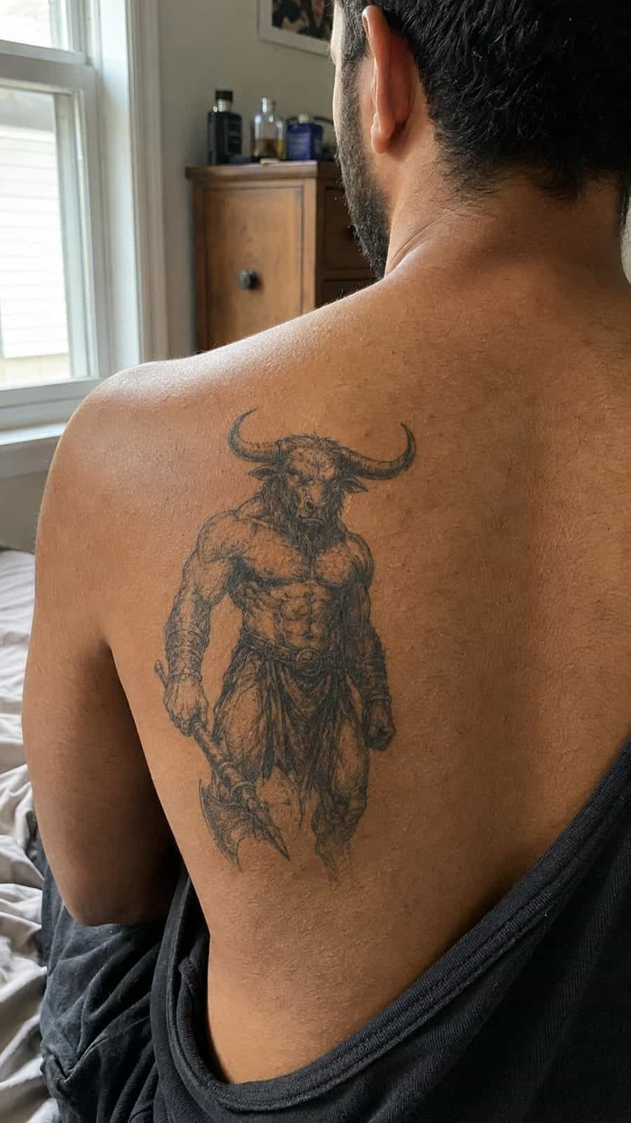 Modern Spartan: 18 Greek Tattoo Ideas Every Man Should Consider 23 Healed the minotaur tattoo on a adult man's upper back, photographed in a natural relaxed documentary crop — study 3