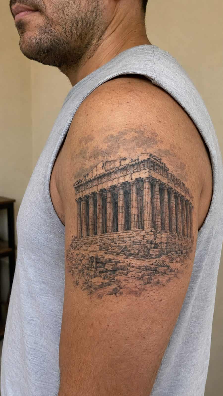 Modern Spartan: 18 Greek Tattoo Ideas Every Man Should Consider 24 Healed the parthenon tattoo on a adult man's shoulder, photographed in a natural relaxed documentary crop — study 1