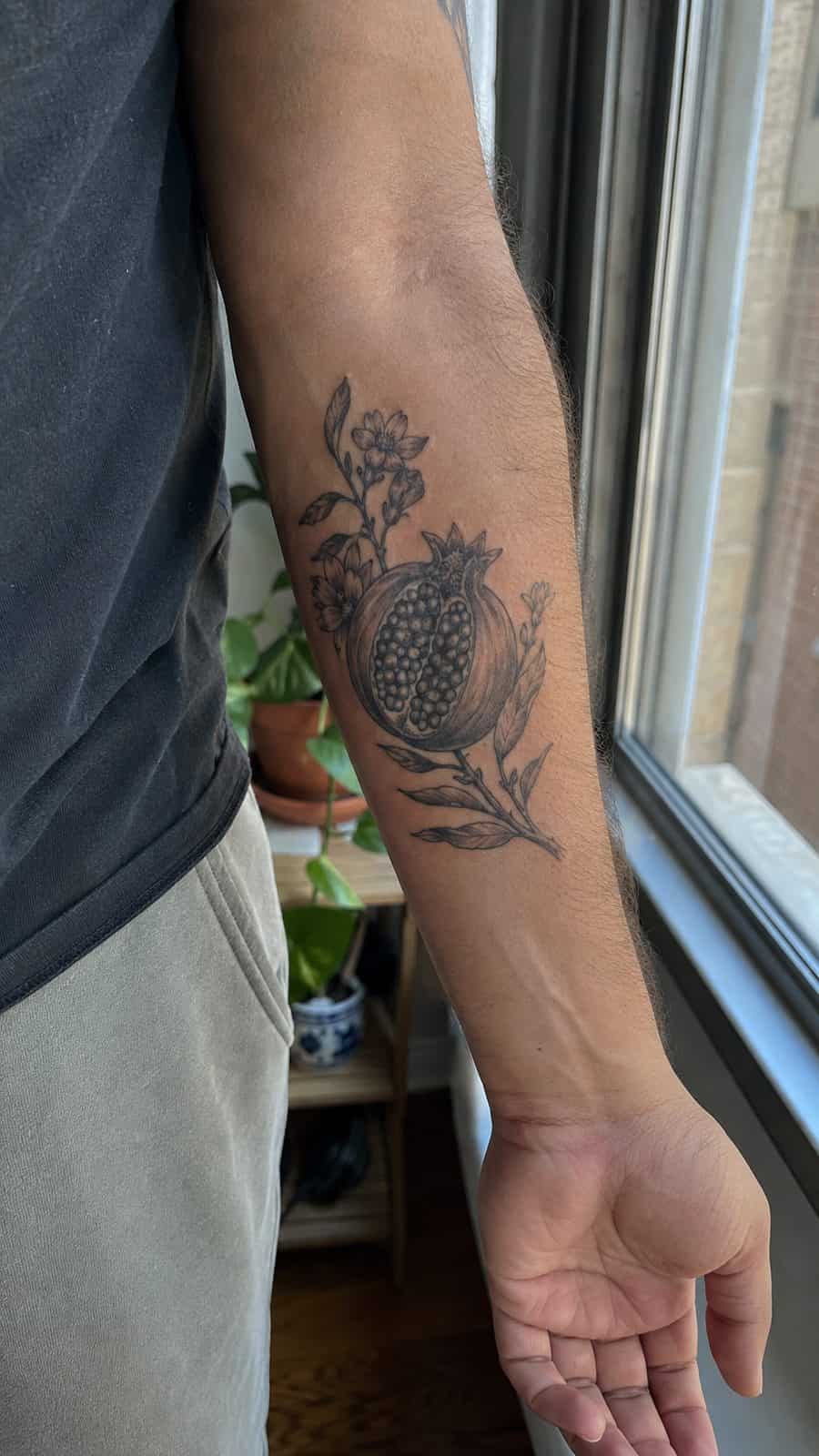 Modern Spartan: 18 Greek Tattoo Ideas Every Man Should Consider 27 Healed persephone's pomegranate tattoo on a adult man's inner forearm, photographed in a natural waist-height candid close-up — study 1