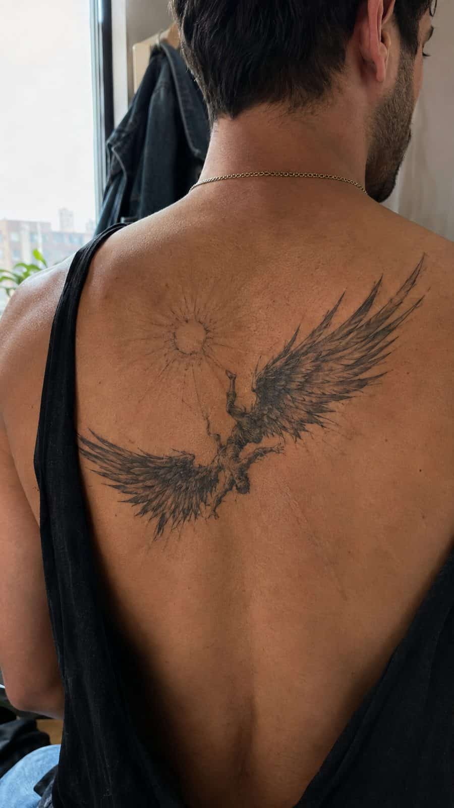 Modern Spartan: 18 Greek Tattoo Ideas Every Man Should Consider 30 Healed icarus's wings tattoo on a adult man's upper back, photographed in a natural straight-on close view, a touch off-center like a — study 2