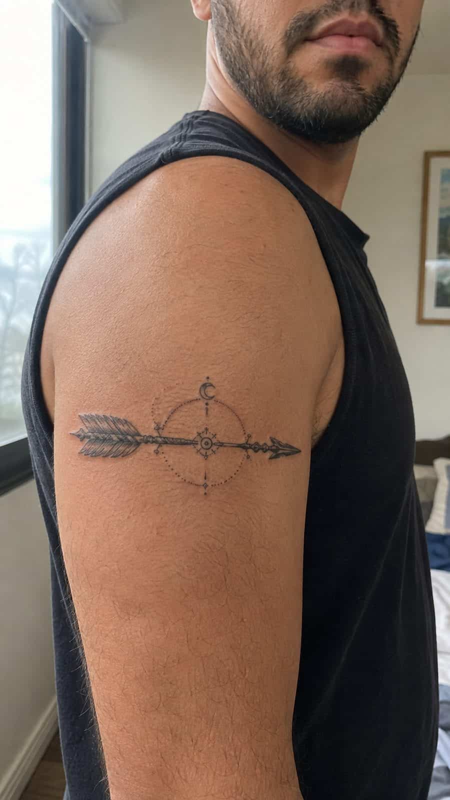 Modern Spartan: 18 Greek Tattoo Ideas Every Man Should Consider 31 Healed artemis's arrow tattoo on a adult man's shoulder, photographed in a natural casual close three-quarter view — study 1